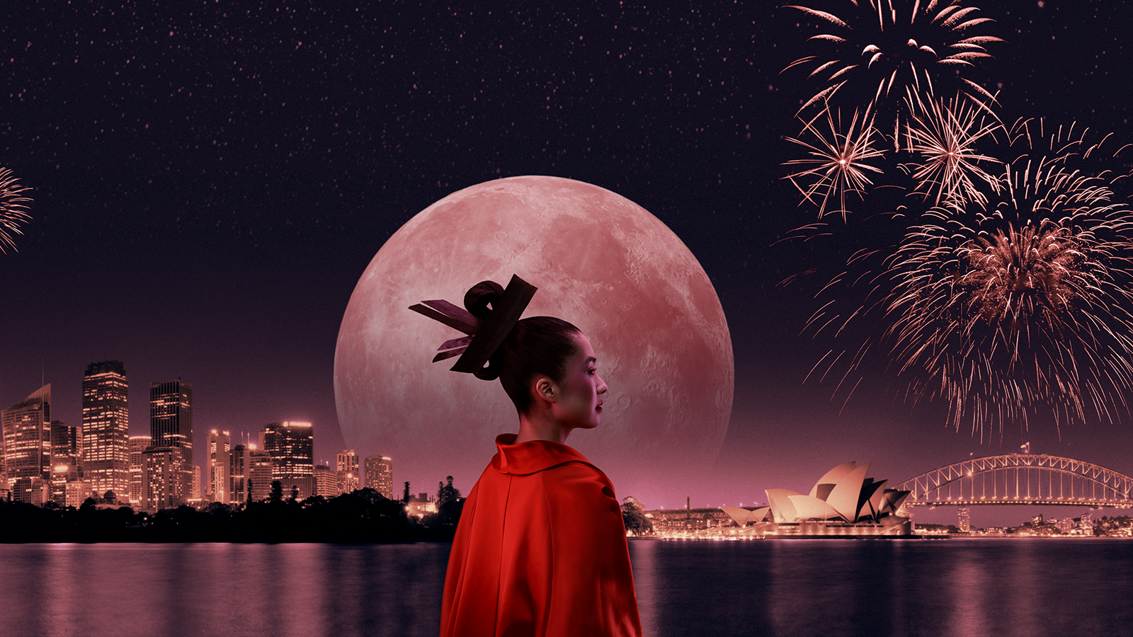 A woman in red dress with fireworks in the background.