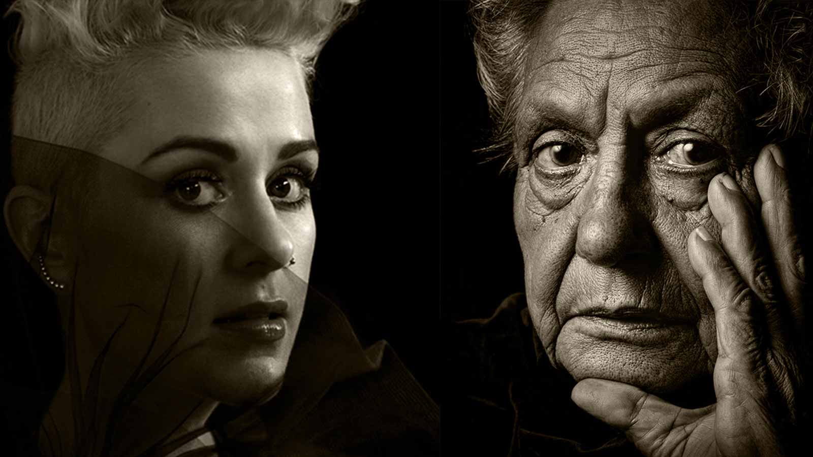 A woman with short blonde hair next to a man with a wrinkled appearance hand resting on his face.