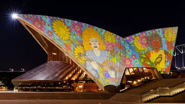 Badu Gili in wonder women art lit up on the Bennelong Sail of Sydney opera house.