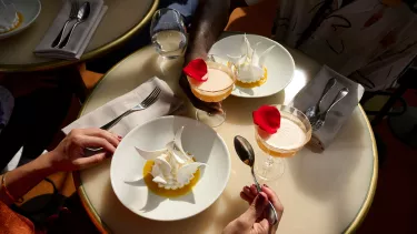 Desserts and cocktails on a table.