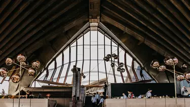 Waiters serving the diners in the Bennelong restaurant at Sydney opera house.