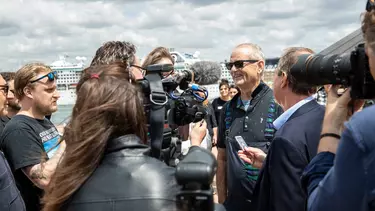 Bill Murray an American actor getting interviewed by media outside Sydney opera house.