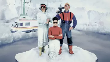 Three news reporters on a broken iceberg floating off to sea