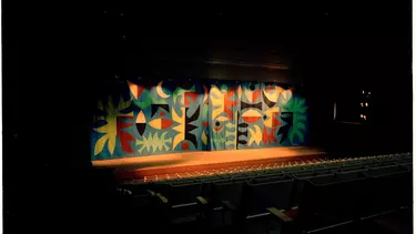 A curtain in the Concert hall with tapestry art.