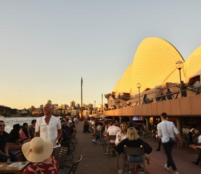 The House Canteen next to the sails as the sun sets.