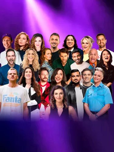21 comedians of all different genres and backgrounds pose behind Melanie Bracewell, a white woman with brown medium length hair wearing a black V-neck top. The background is purple.