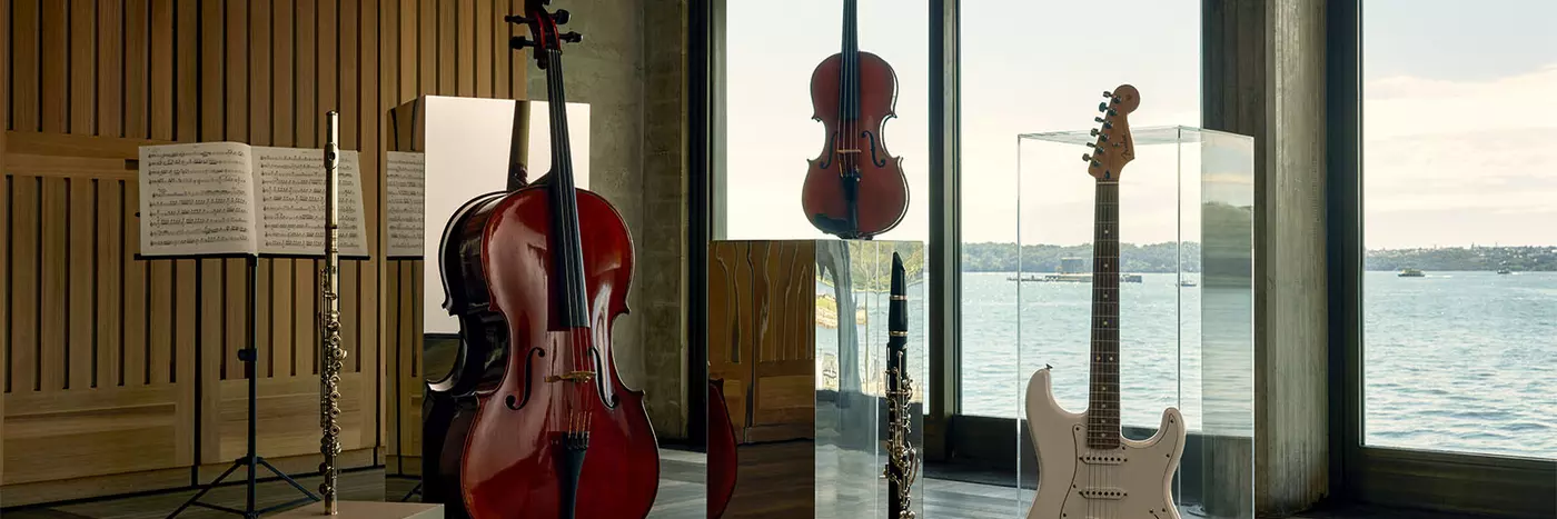 Three string instruments and two flutes showcased in Utzon's room.