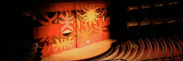 A curtain in the Concert hall with tapestry art.